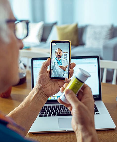 Close up of a senior man consulting with a doctor on his phone